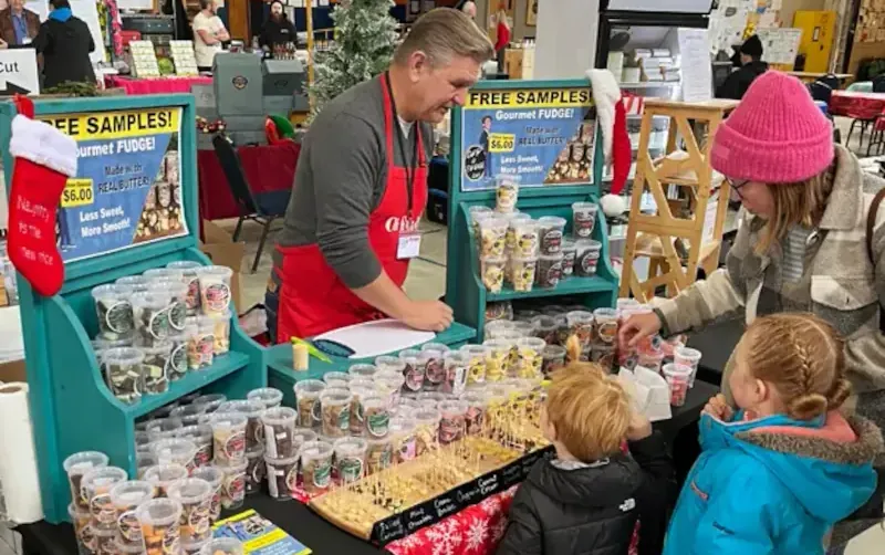 Children picking out gourmet fudge samples at the Lofty Butter Company stall in Belleville.